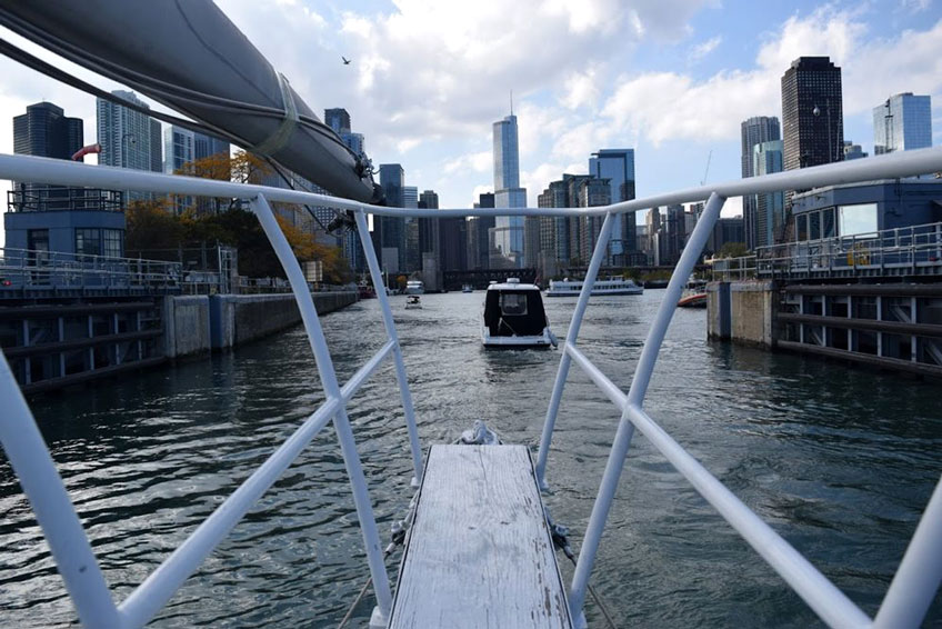 View of the Chicago River from the bow of a sailboat