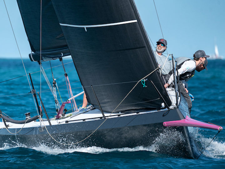 A Cape 31 sailboat racing upwind.