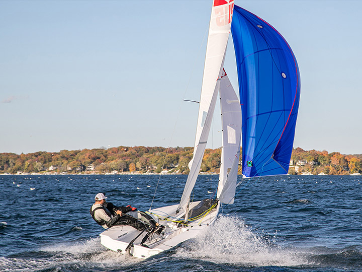 A Melges 15 sailing downwind